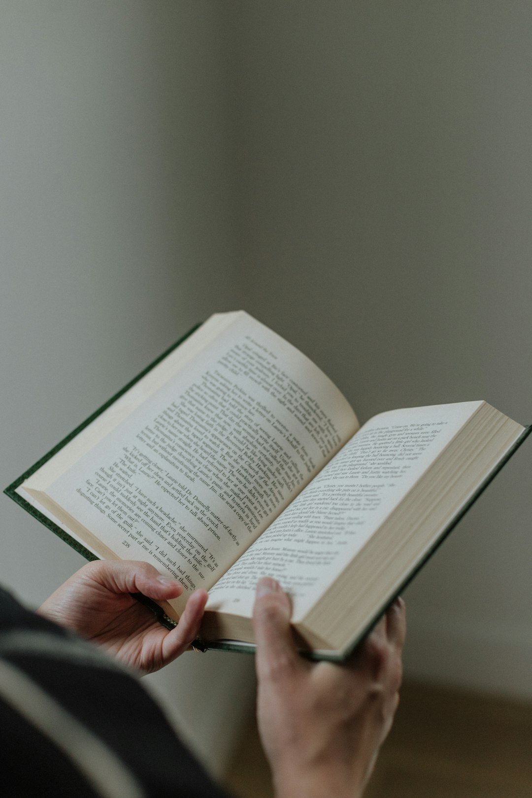 person reading mystery novel